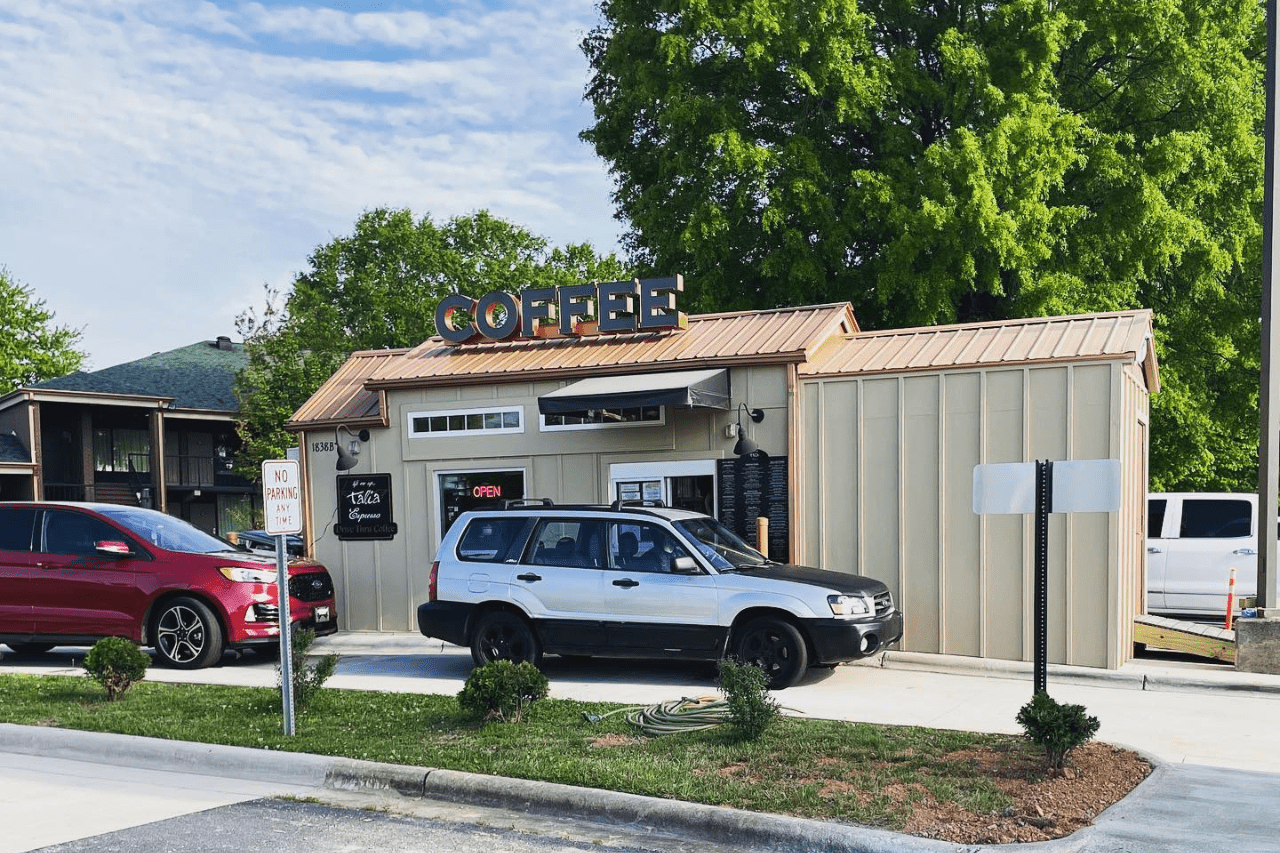 Drive-through coffee shop with cars